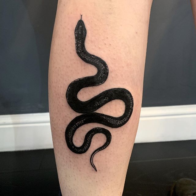 black small snake tattoo