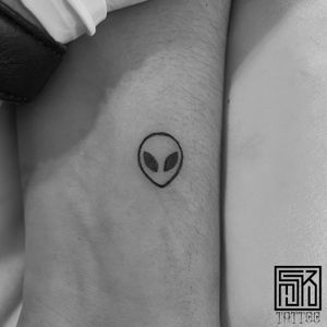 alien logo tattoo