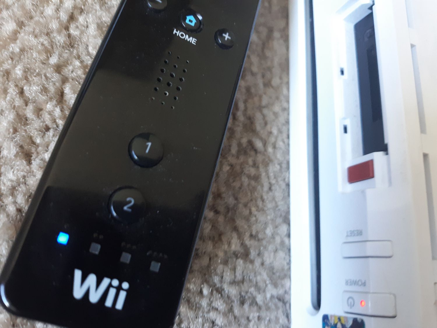 how do you reset a wii remote