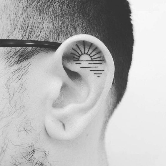 sun ear tattoo