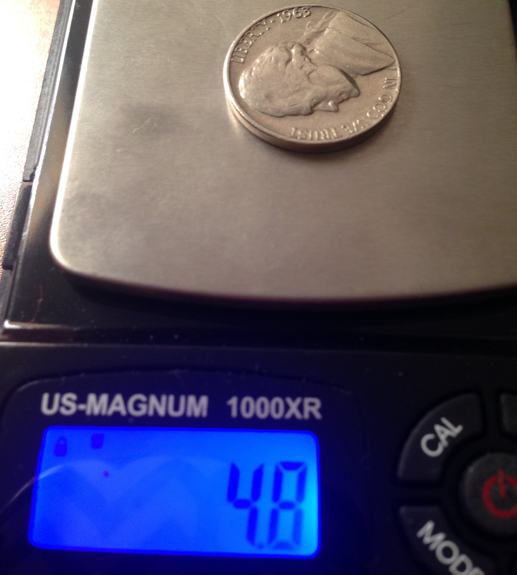 what does a nickel weigh in grams