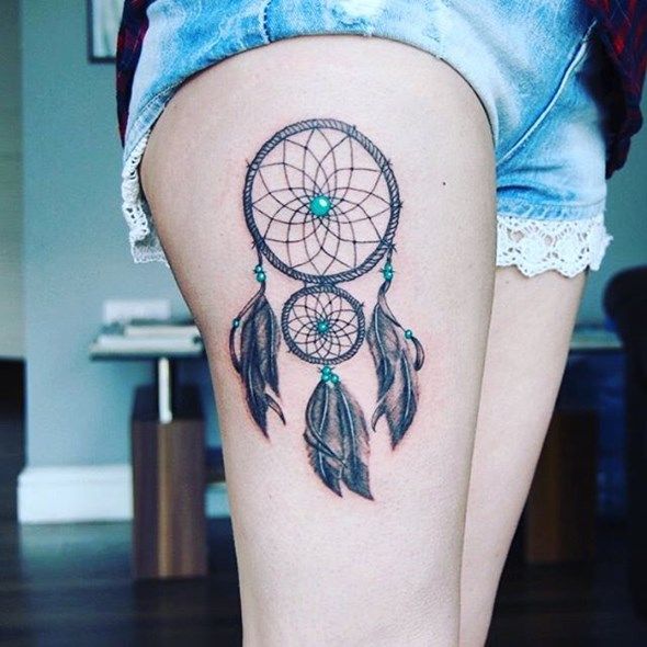 dream catcher tattoo on thigh