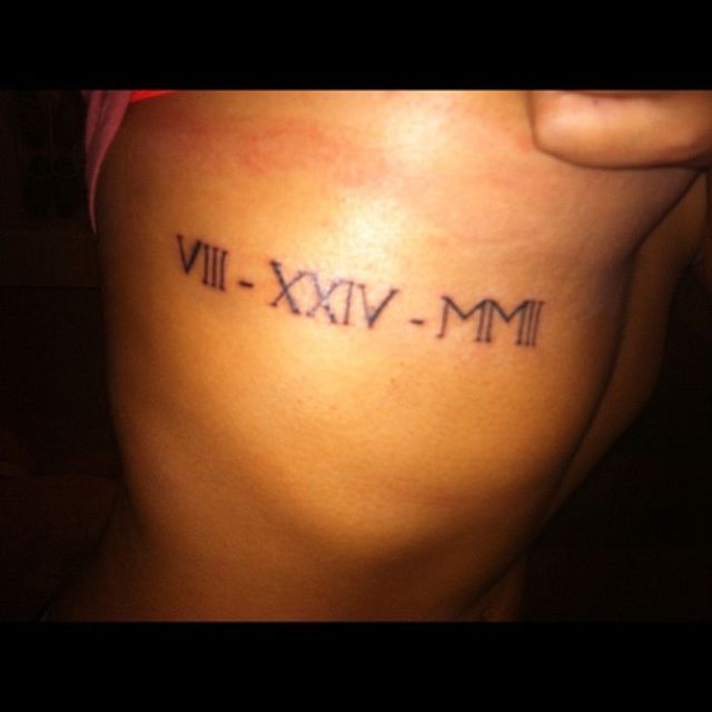 2002 in roman numerals tattoo