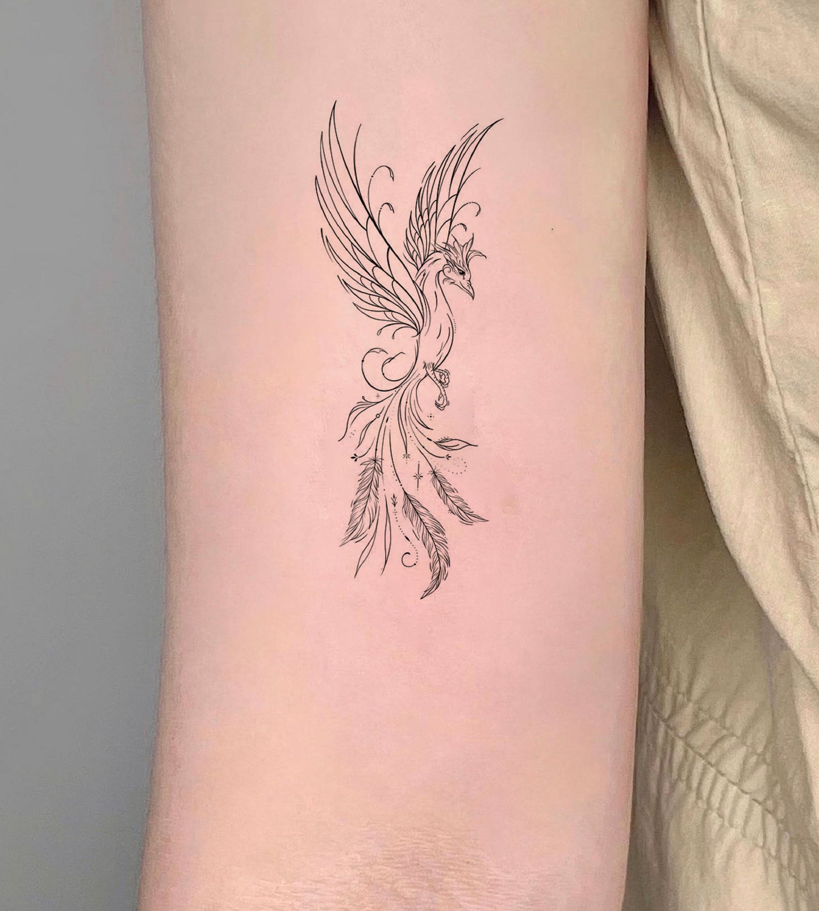 phoenix rises from the ashes tattoo