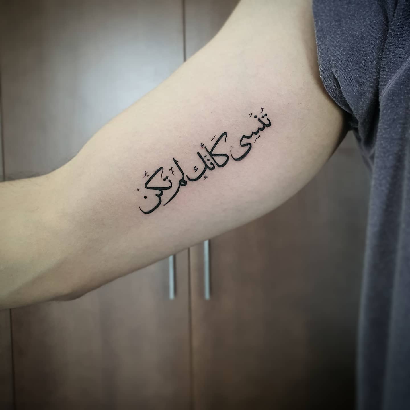 arabic tattoo forearm