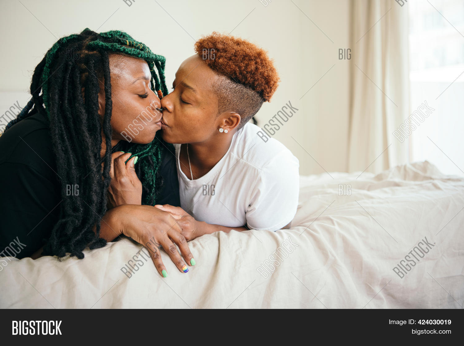 lesbian couple in bed