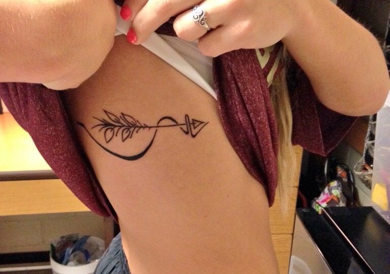 arrow rib tattoo