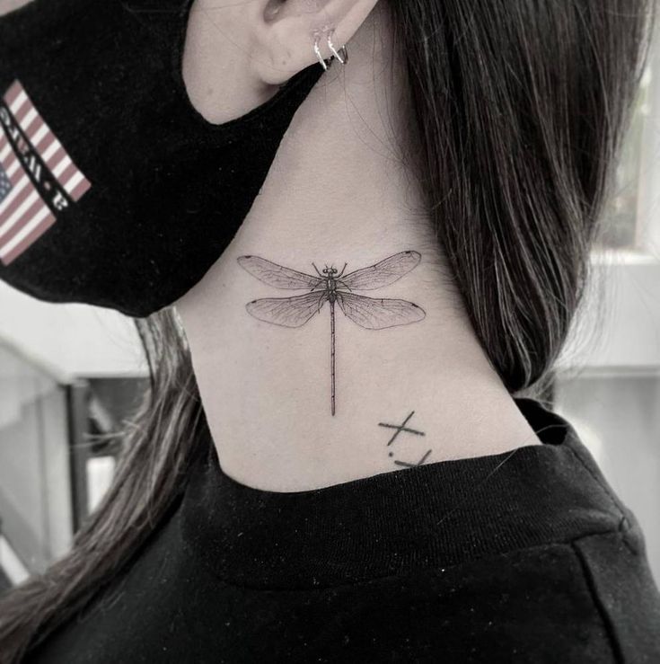 dragonfly neck tattoo