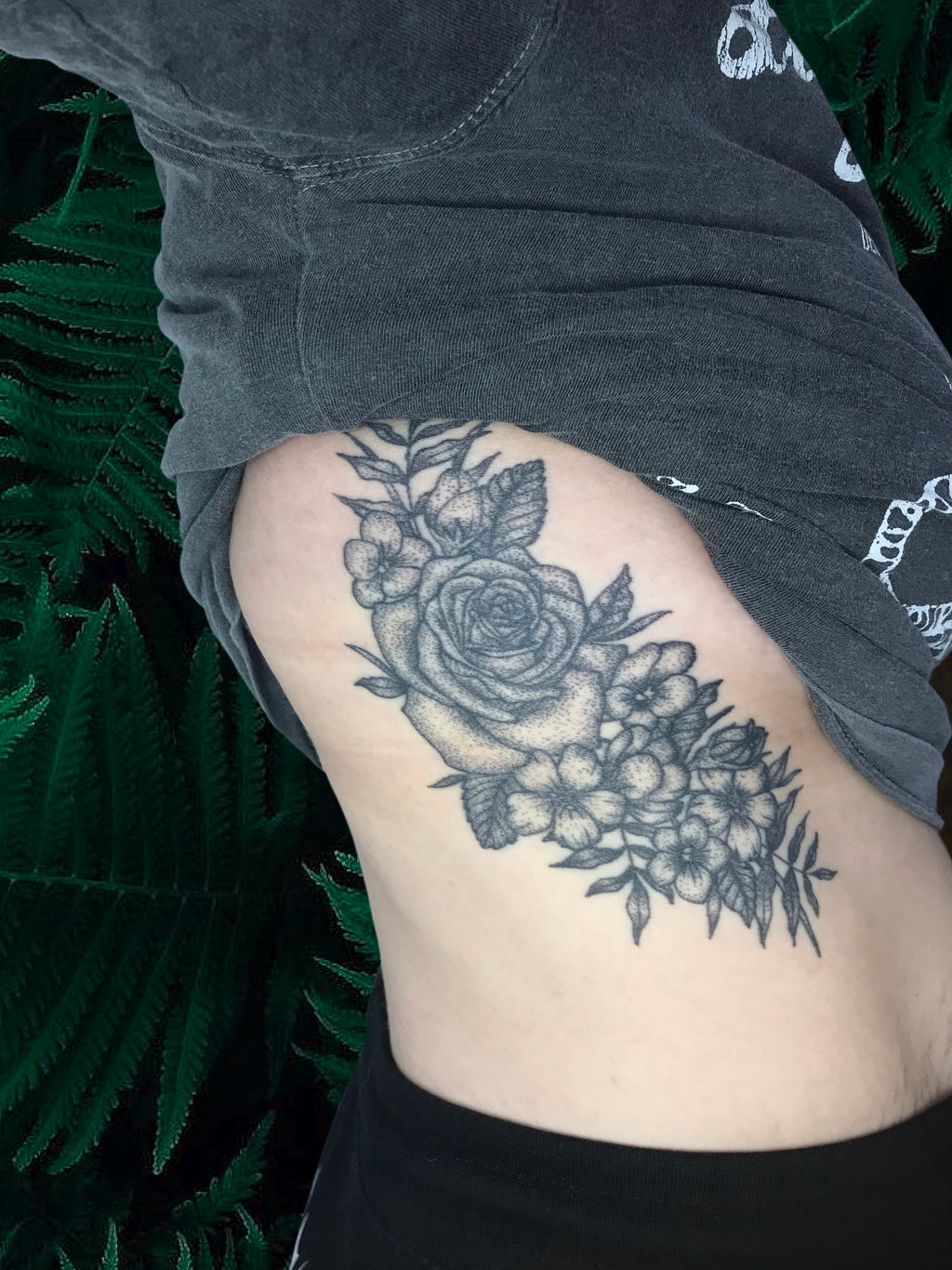 floral rib tattoo