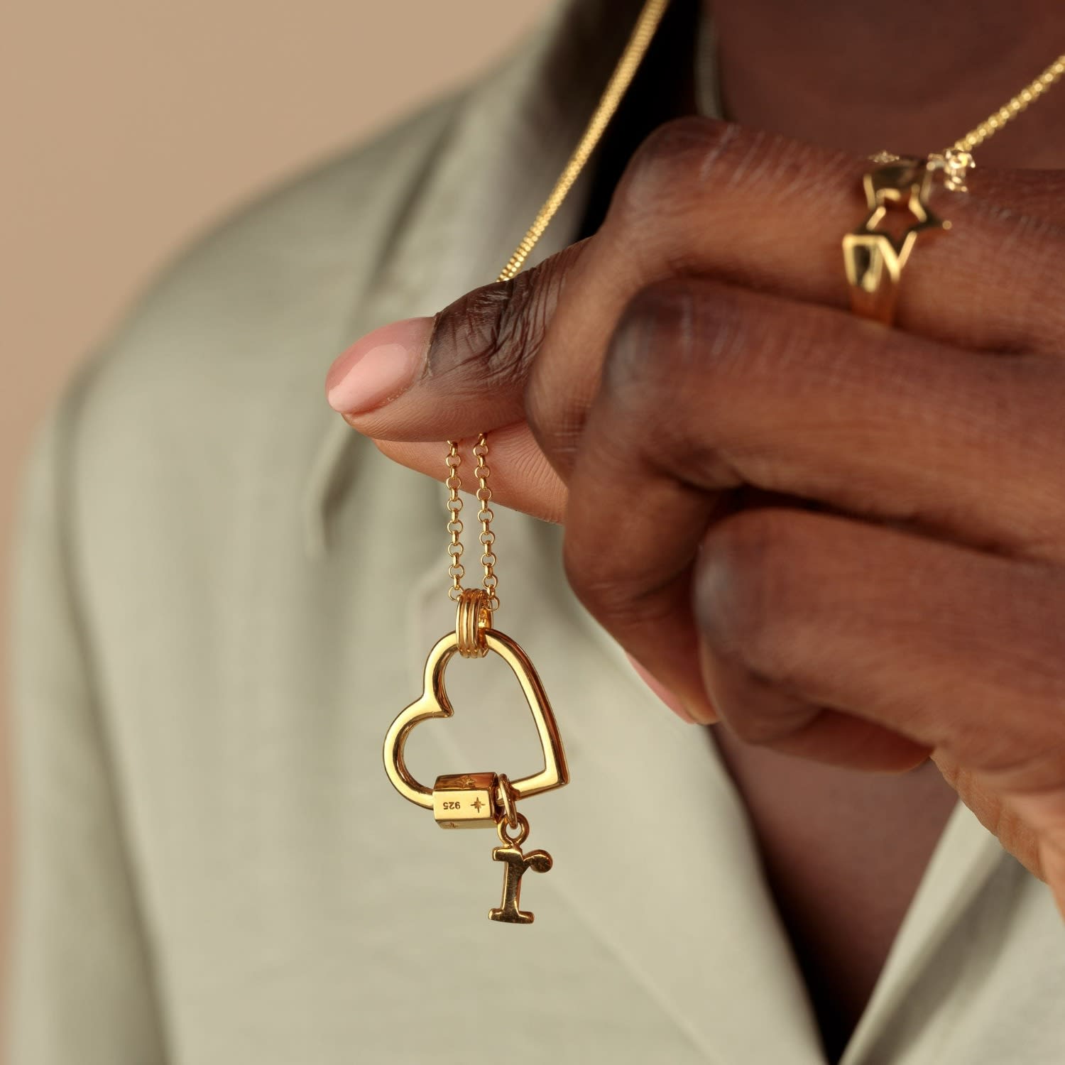 gold carabiner necklace with charms