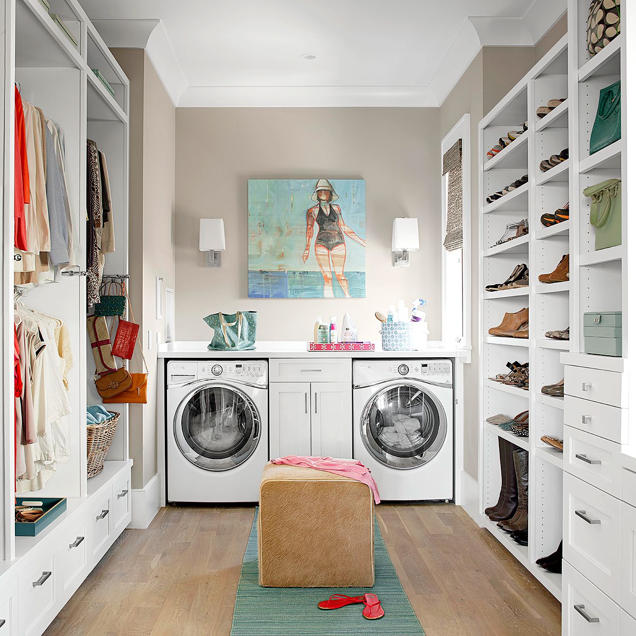 small walk in closet with washer and dryer