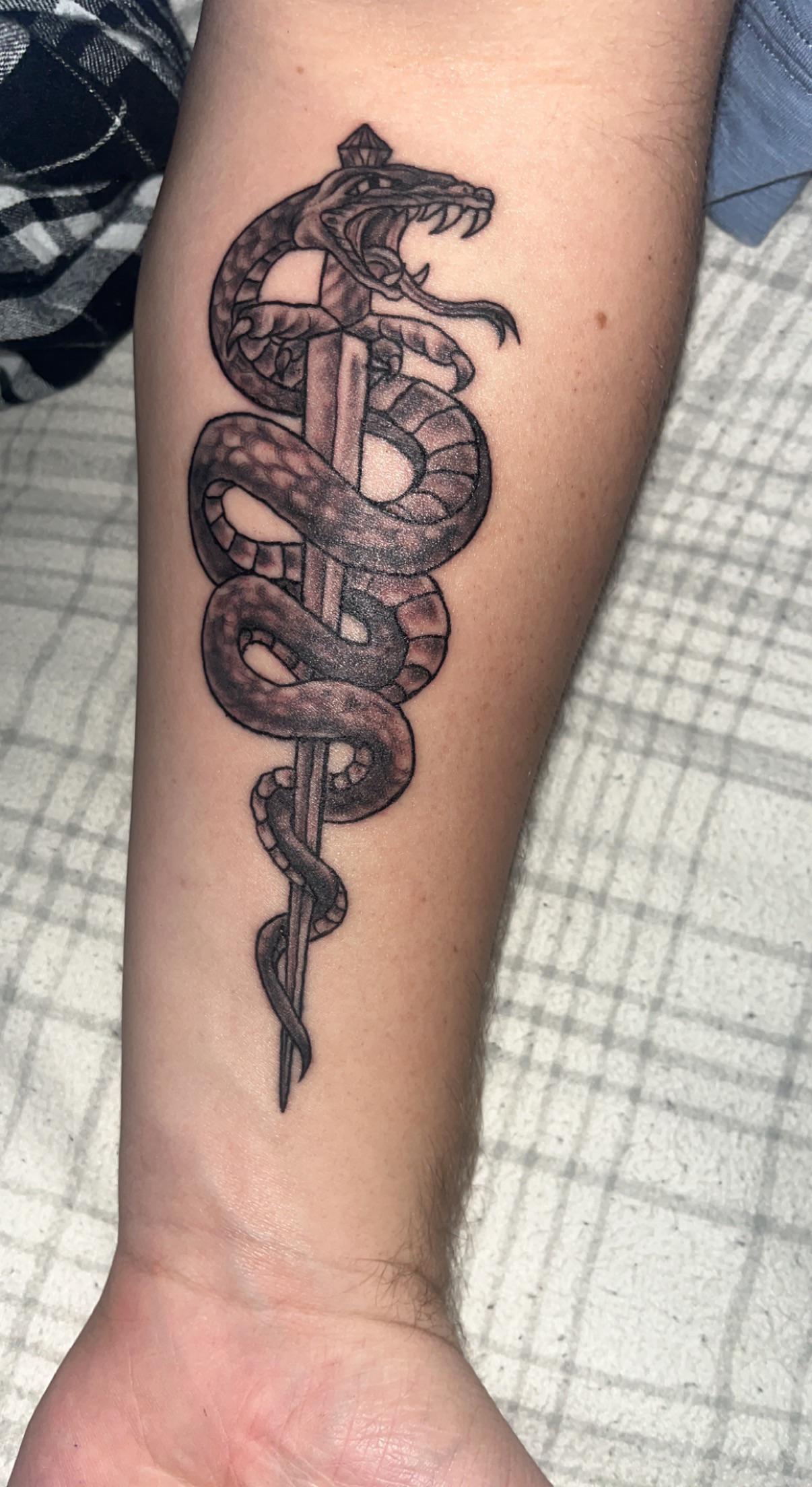 snake with dagger tattoo meaning