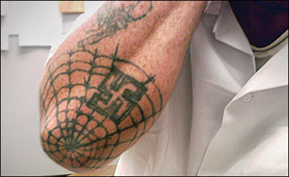 what does spider web tattoo on elbow mean